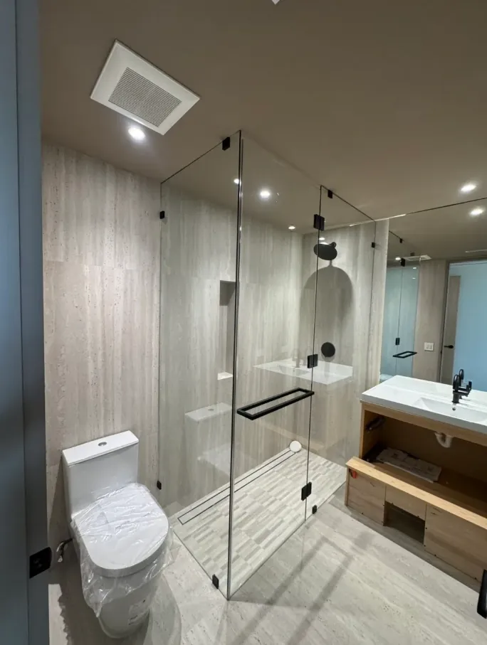 Gray linear-tile shower suite