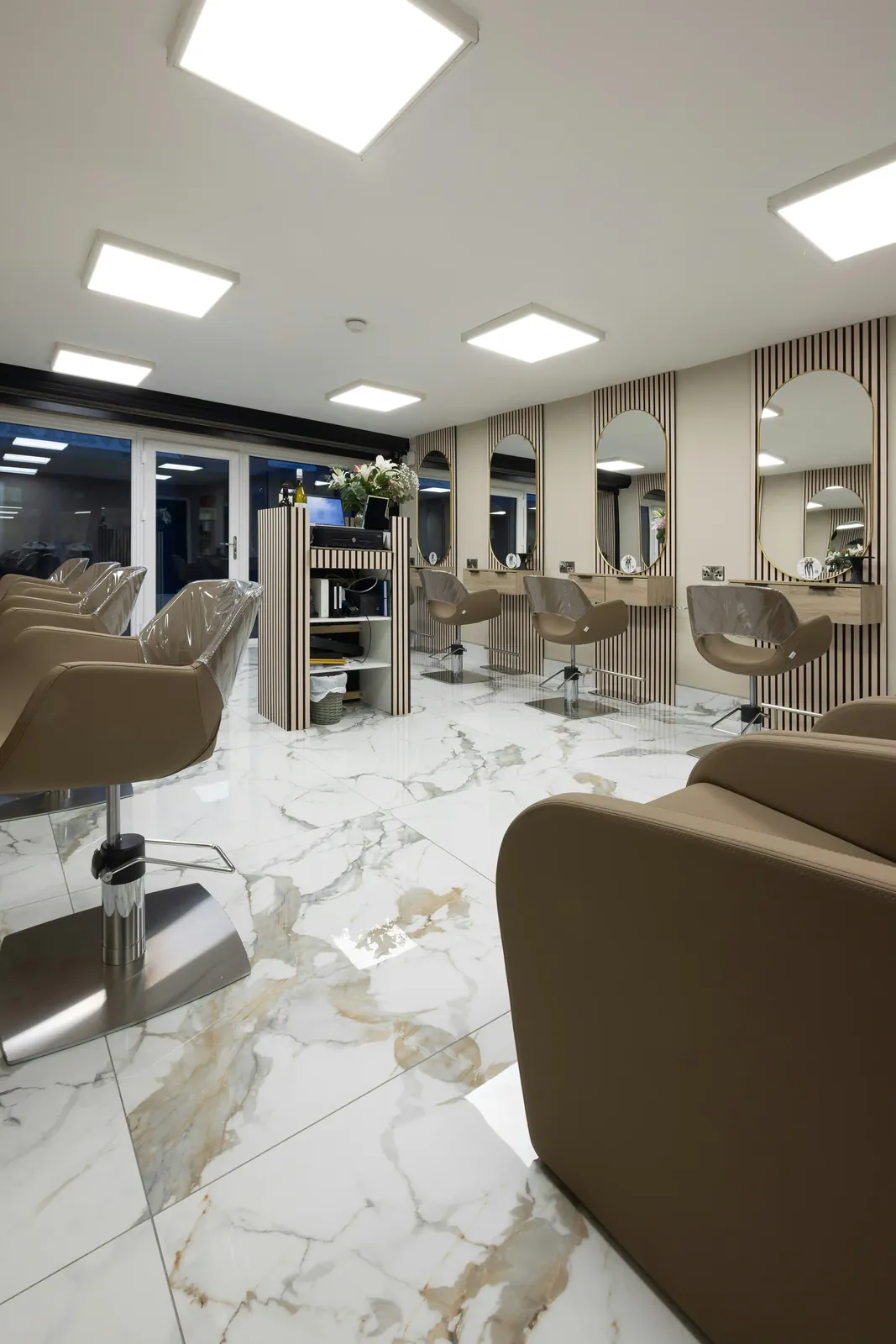 Hair salon with veined white floor tiles