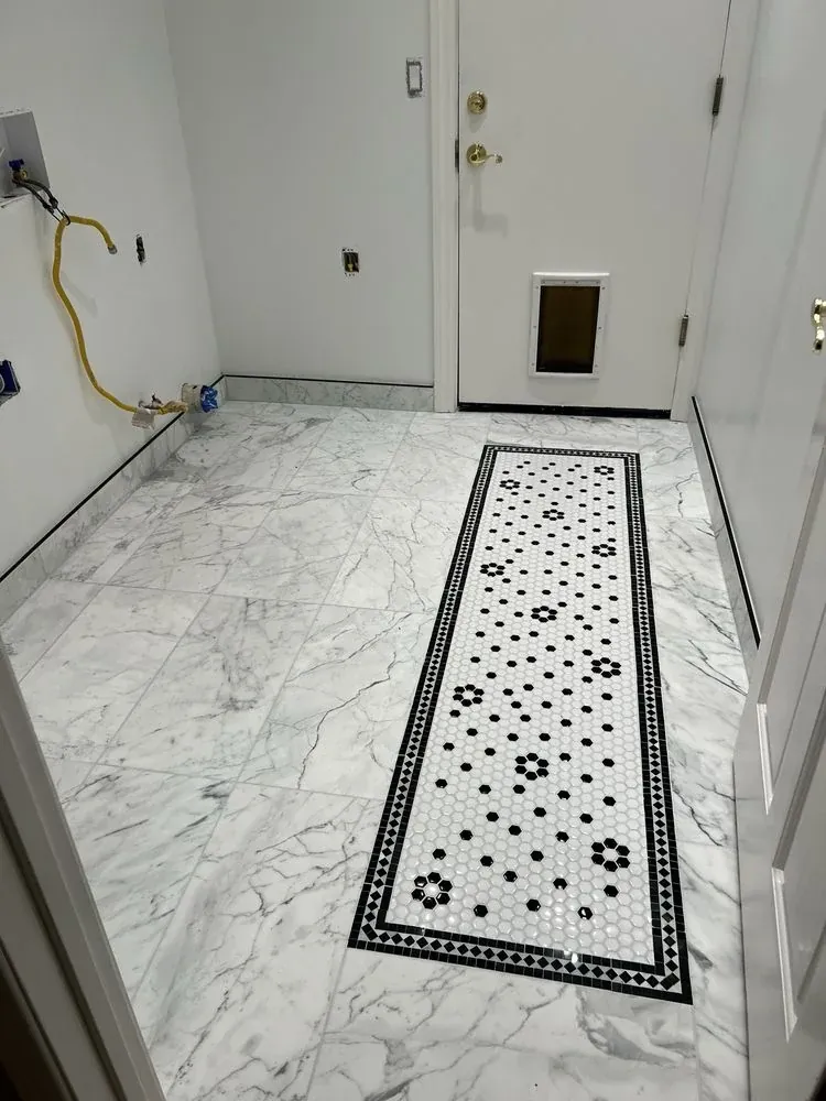 Marble-look floor with black-and-white hex mosaic inset