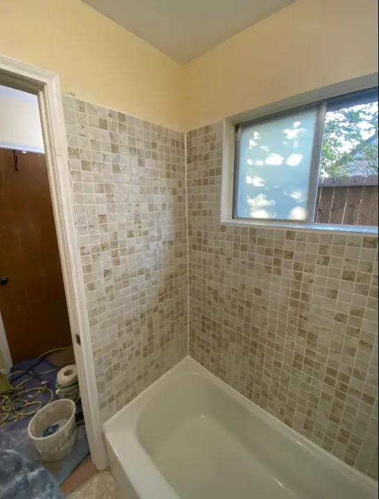 Small square-tile bathtub surround