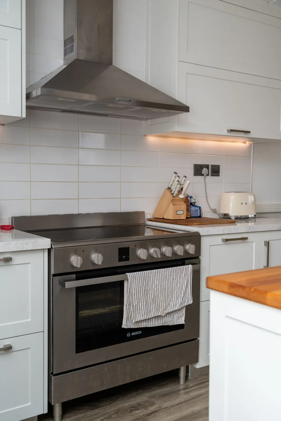 White rectangular tile kitchen backsplash