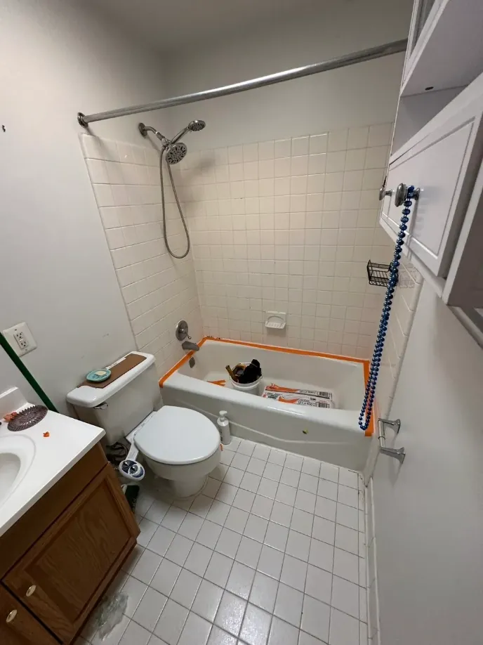 White veined-tile tub bathroom remodel