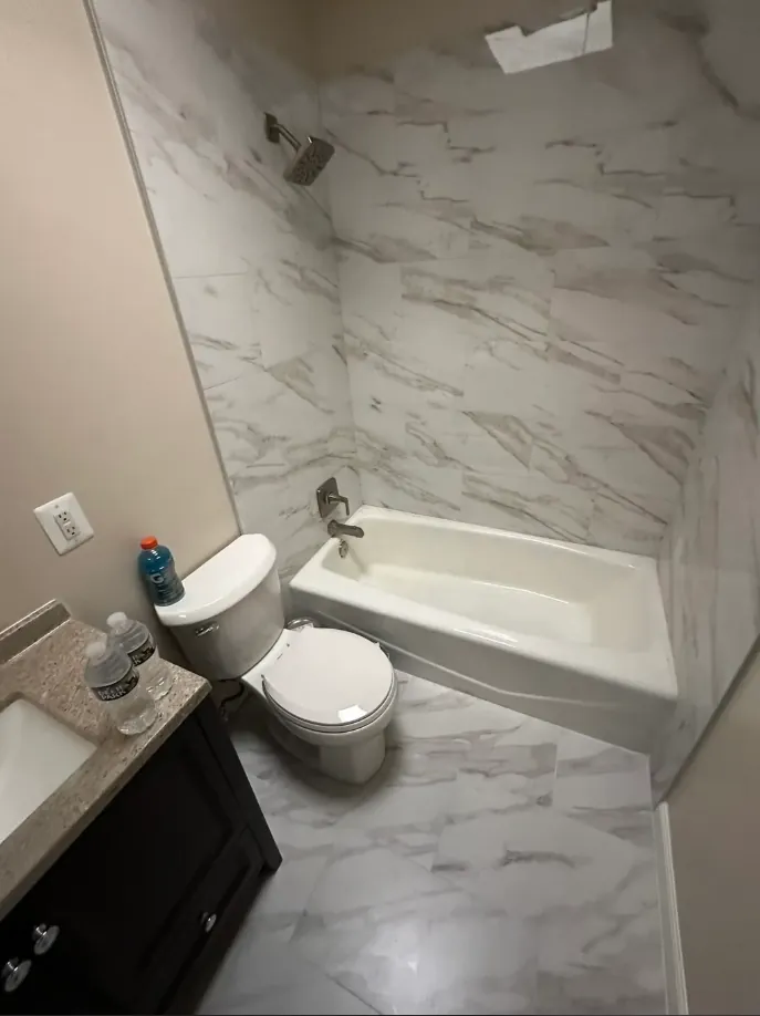 White veined-tile tub bathroom remodel